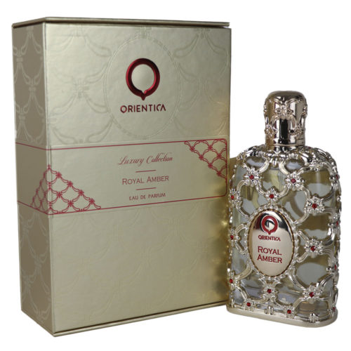 Royal Amber Eau de Parfum 80ml de Orientica, presenta un lujoso frasco con una ornamentada capa plateada con detalles rojos, junto a su envase dorado a juego.