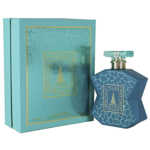 Green Valley Village Eau de Parfum de Metropolis en un frasco azul de forma única, expuesto junto a su caja turquesa a juego con detalles dorados y un estampado texturizado.