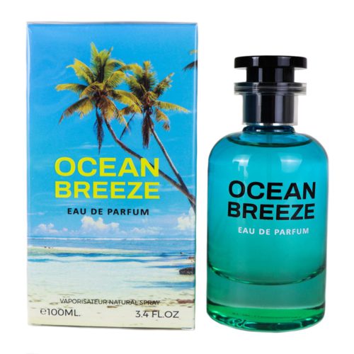 Un frasco de perfume azul transparente con una tapa negra, junto a un empaque con una escena de playa tropical con palmeras, etiquetado como "Ocean Breeze Eau de Parfum."