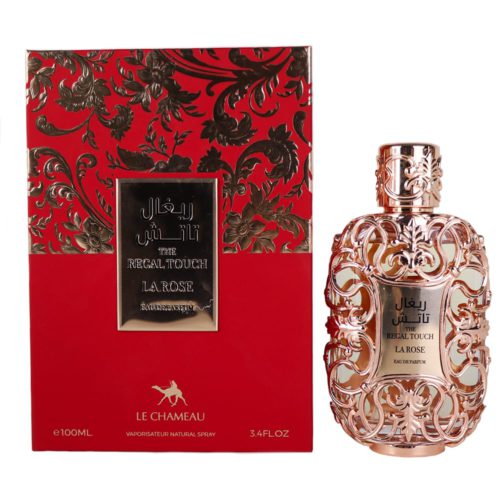 Un frasco de perfume dorado ornamentado con intrincados patrones florales, junto a un empaque rojo y dorado etiquetado como "The Regal Touch La Rose Eau de Parfum."