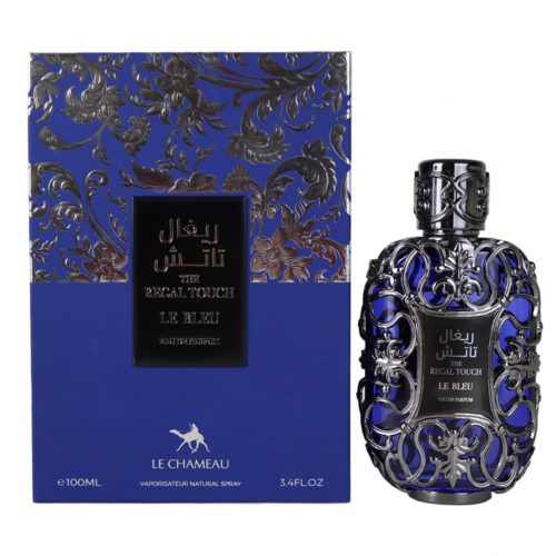 Un frasco de perfume plateado ornamentado con intrincados patrones florales y detalles azules, junto a un empaque azul y plateado a juego etiquetado como "The Regal Touch Le Bleu Eau de Parfum."