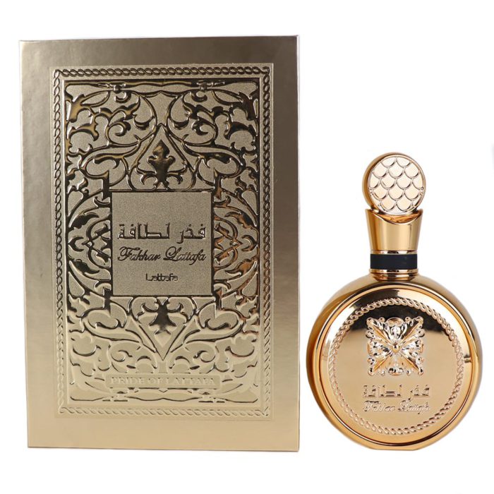 Fakhar Lattafa Eau de Parfum, con un lujoso frasco de perfume dorado con detalles intrincados, junto a una caja de embalaje con relieve dorado ornamentado.