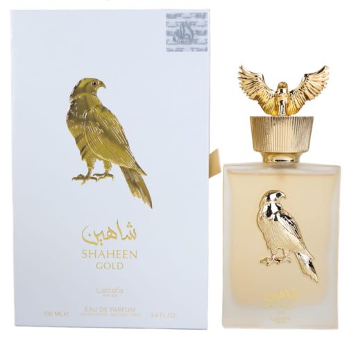 Shaheen Gold Eau de Parfum de Lattafa, con un lujoso frasco dorado decorado con un emblema de halcón y tapa a juego, acompañado de una elegante caja blanca y dorada.