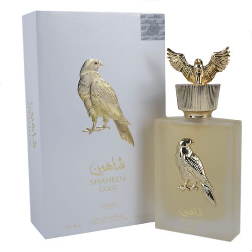 Eau de Parfum Shaheen Gold de Lattafa, frasco y envase de 100 ml. El elegante frasco blanco presenta un emblema de halcón dorado y se exhibe junto a su envase blanco y dorado a juego.