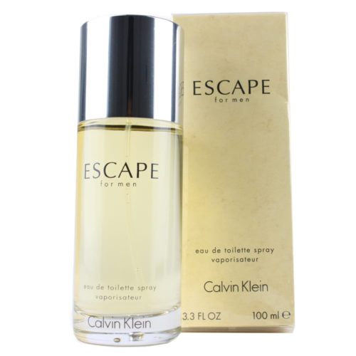 Escape Eau de Toilette 100 ml para hombre de Calvin Klein, con un frasco cilíndrico transparente con tapón plateado, que se muestra junto a su envase beige.