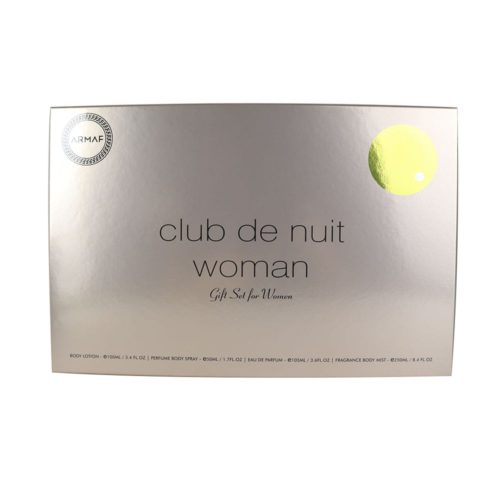 Una caja de regalo plateada de "Club de Nuit Woman" de Armaf. La caja tiene un diseño minimalista con el nombre del producto en texto negro y un círculo amarillo en la esquina superior derecha. El empaque menciona que el set incluye Eau de Parfum (100ml), Loción Corporal (100ml), Body Spray (50ml) y Bruma Perfumada (250ml).