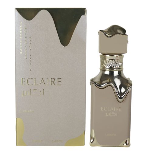 Eau de Parfum Lattafa Eclaire, 3.4 fl oz (100 ml). La botella de perfume en tonos beige y dorado se encuentra junto a su empaque a juego, con un diseño de goteo metálico lujoso. El conjunto transmite elegancia y sofisticación.