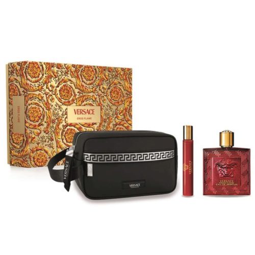 Set de regalo Eros Flame de Versace para hombre, que incluye un frasco rojo de Eau de Parfum de 100 ml, un spray de viaje de 10 ml y un neceser negro con diseño de grecas, presentado en una caja decorativa dorada y roja.