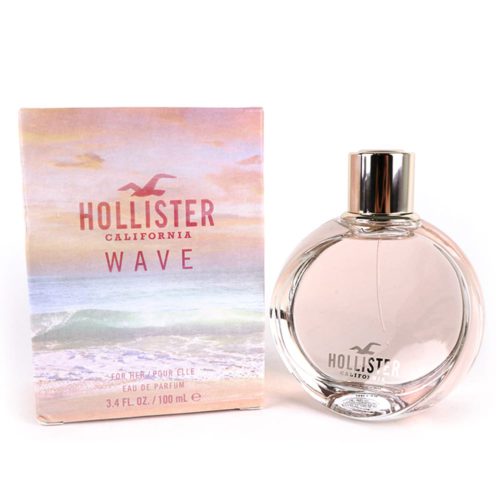 Hollister Wave Eau de Parfum 100ml para mujer, con un frasco redondo transparente de tono rosado y tapa plateada, junto a un empaque con temática de playa.