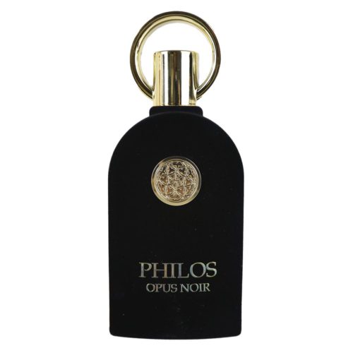 Un frasco de perfume negro con textura de terciopelo de Philos Opus Noir de Maison Alhambra, con un adorno circular dorado y una tapa dorada con asa en forma de anillo.