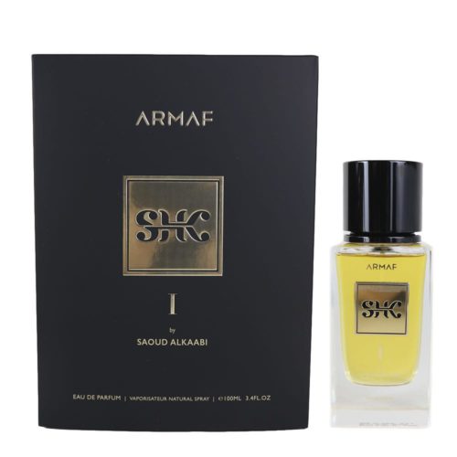 HK I Eau de Parfum 100ml de Armaf. Una fragancia masculina lujosa en una botella transparente con etiqueta dorada, presentada junto a su elegante empaque negro y dorado.