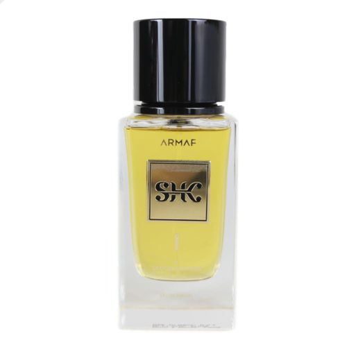 Primer plano de la botella de SHK I Eau de Parfum de Armaf. Una botella de vidrio transparente con etiqueta dorada y tapa negra, que irradia elegancia y sofisticación.