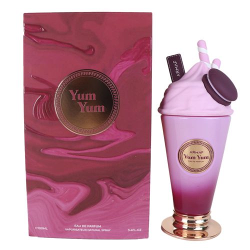 Armaf Yum Yum Eau de Parfum 100ml para mujer. Un frasco de perfume en forma de batido con una galleta y popotes, junto a su empaque rosado marmoleado.