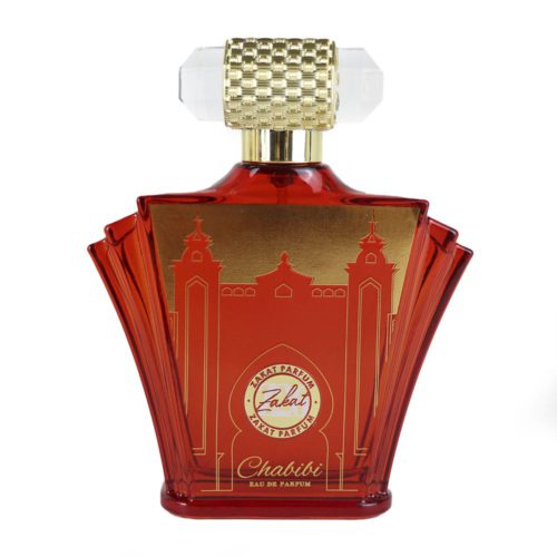 Vista frontal del frasco del perfume Chabibi con diseño arquitectónico en rojo y dorado, tapa texturizada dorada y extremos transparentes.
