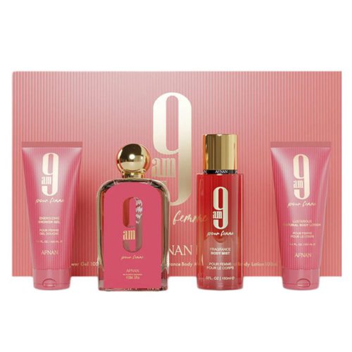 Set de regalo Afnan 9AM Pour Femme, con una colección en tonos rosa y dorado que incluye un frasco de perfume, body mist, gel de ducha y loción corporal, elegantemente dispuestos frente a su empaque rosa a juego.