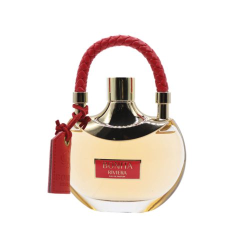 Vista frontal del frasco de perfume Bonita Riviera, con diseño redondo transparente, tapa dorada y asa trenzada roja.